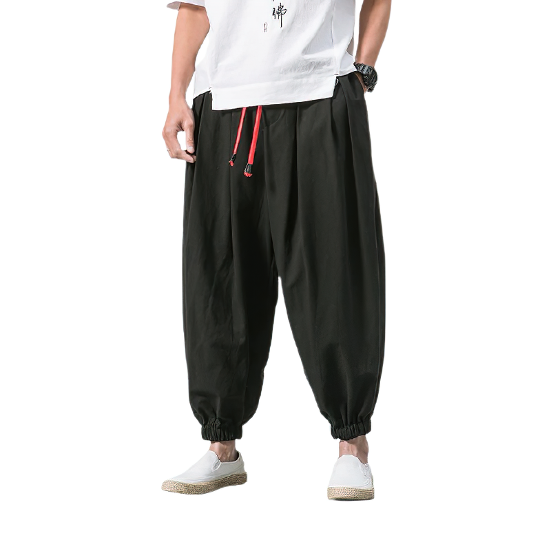 Casual men's loose black cotton linen pants with elastic cuffs and red drawstrings, perfect for summer urban style.