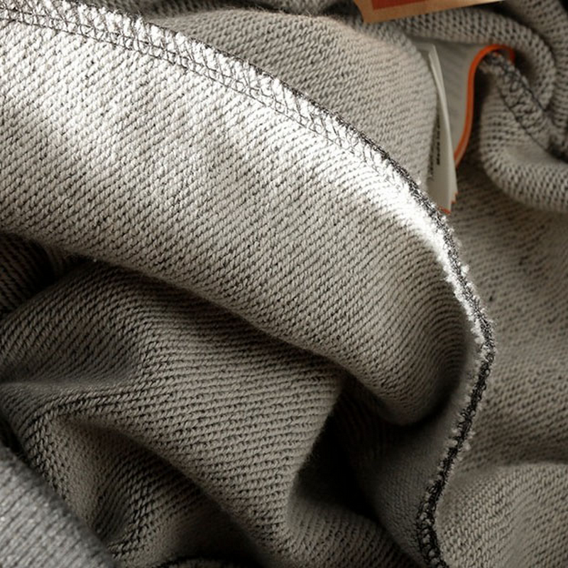 Close-up of soft gray fabric showcasing texture and stitching for men's elastic waist casual pants.
