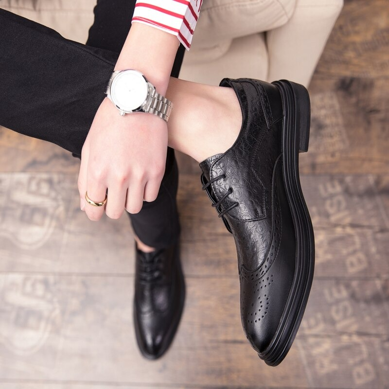 Fashion male genuine leather derby shoes in black worn with stylish outfit, showcasing modern design and quality craftsmanship.