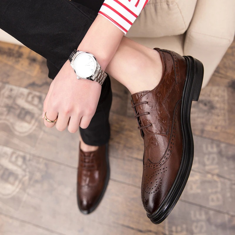 Stylish male wearing brown genuine leather derby shoes with a modern design, showcasing a quality sole and trendy casual style.