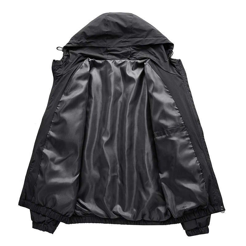 Interior view of a black men's zip-up jacket, featuring a warm lining and hood for comfort in cold weather.