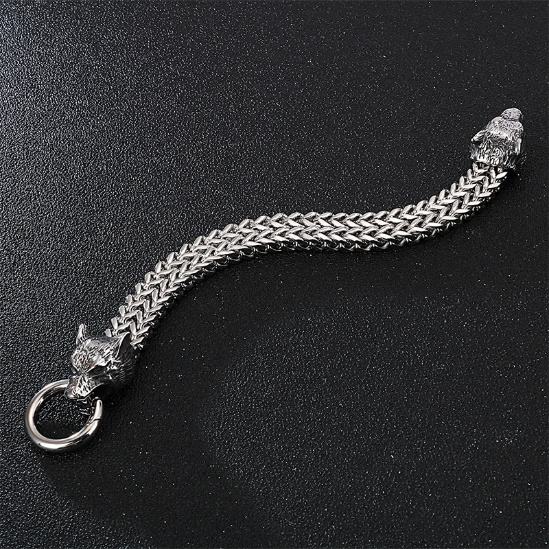Stylish thick stainless steel bracelet with wolf heads, perfect for punk rock fashion and edgy outfits.