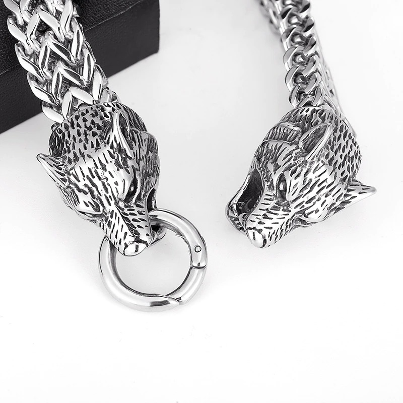 Punk rock stainless steel bracelet featuring wolf heads and a stylish chain design, perfect for edgy fashion.