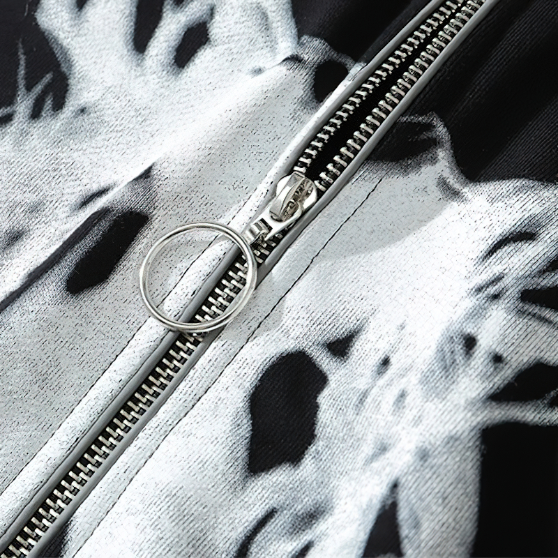 Close-up of black zipper on oversized punk hoodie, highlighting unique graphic print and stylish design.