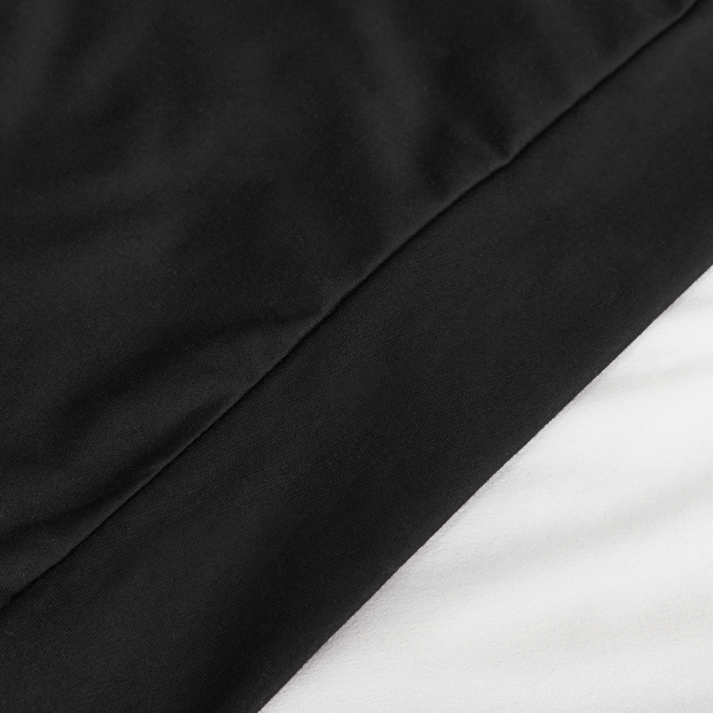 Close-up of the fabric texture of a men's black sleeveless hoodie, showcasing the sleek goth style design.