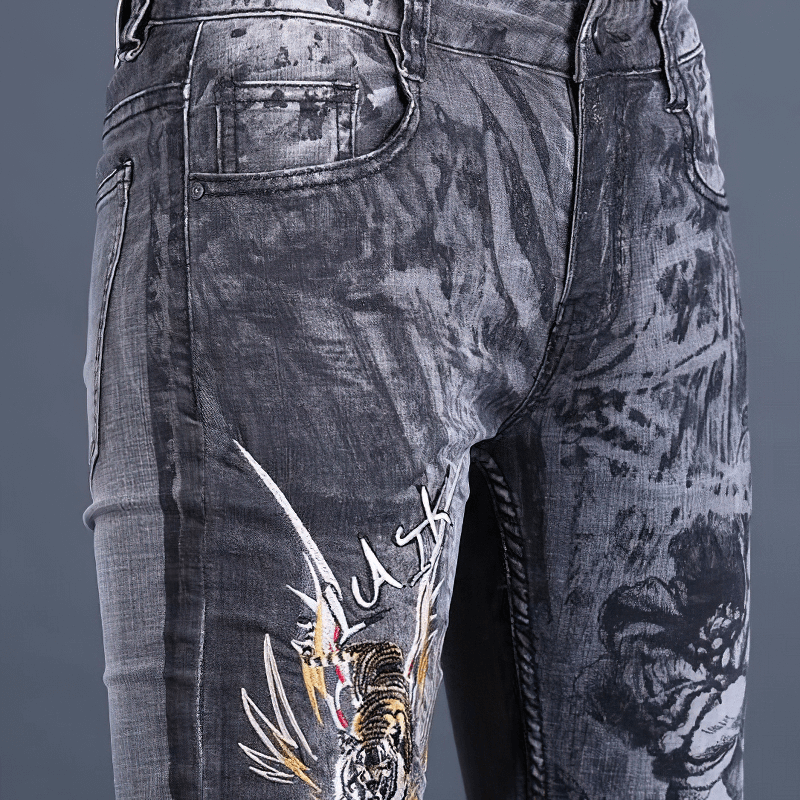 Men's skinny jeans with stylish embroidery and unique gray wash design, perfect for casual outfits and maximum comfort.