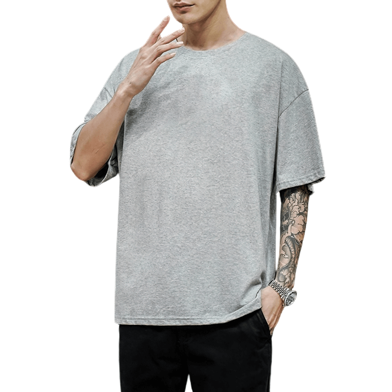 Stylish men's gray oversized cotton t-shirt with loose fit, perfect for alternative fashion enthusiasts.