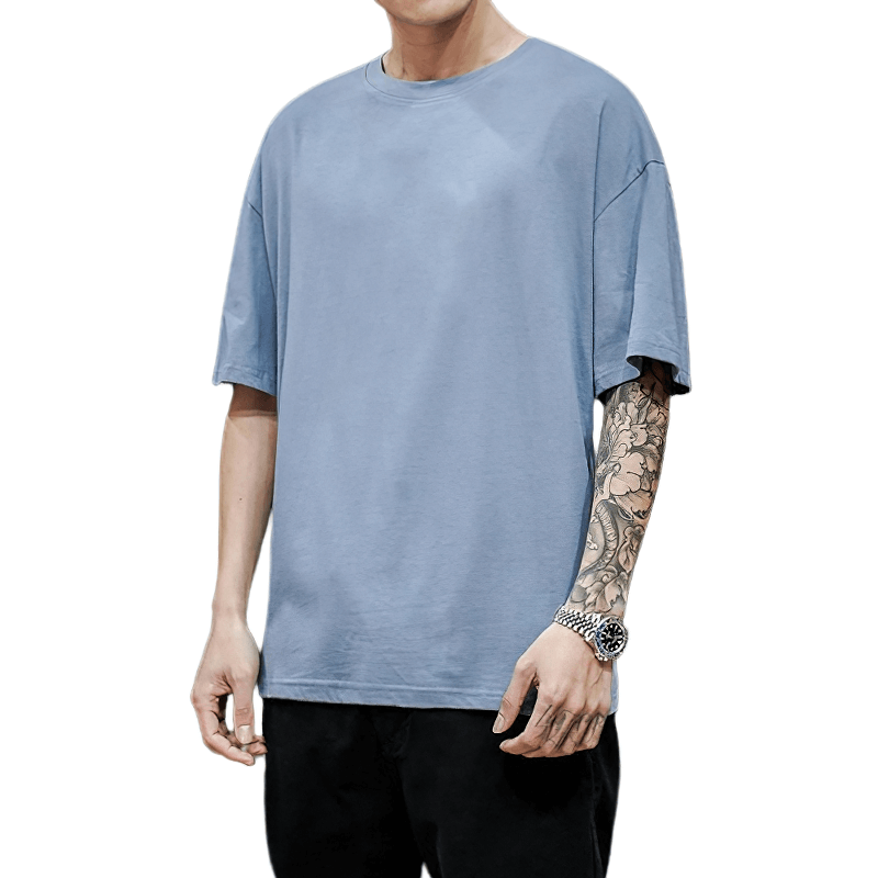 Men's solid cotton loose t-shirt in light blue, showcasing an oversized fit and alternative style for ultimate comfort.