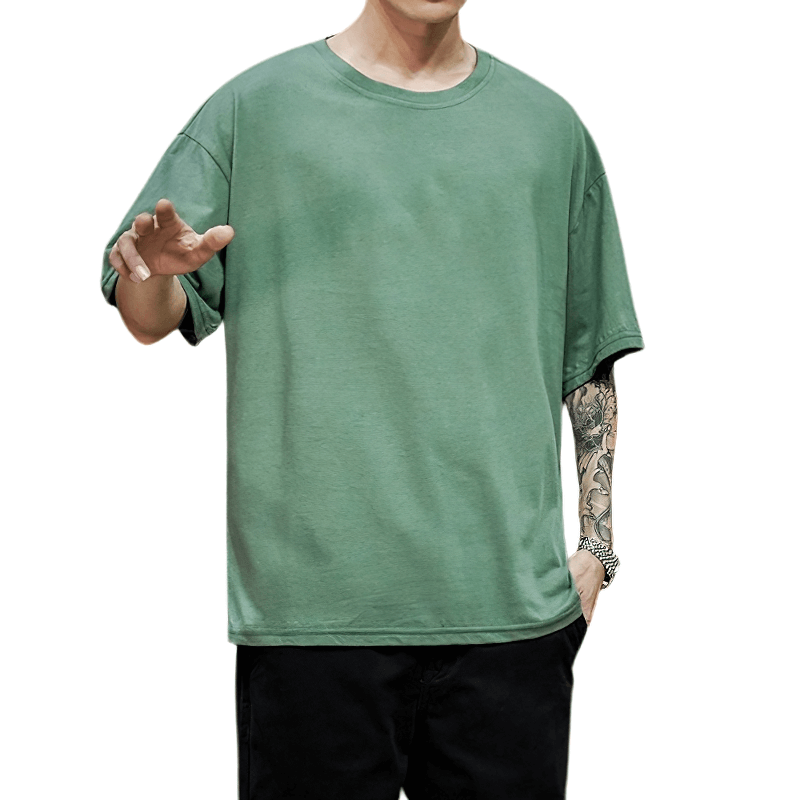Men's solid cotton loose t-shirt in green with oversized fit, perfect for comfortable and fashionable alternative style.