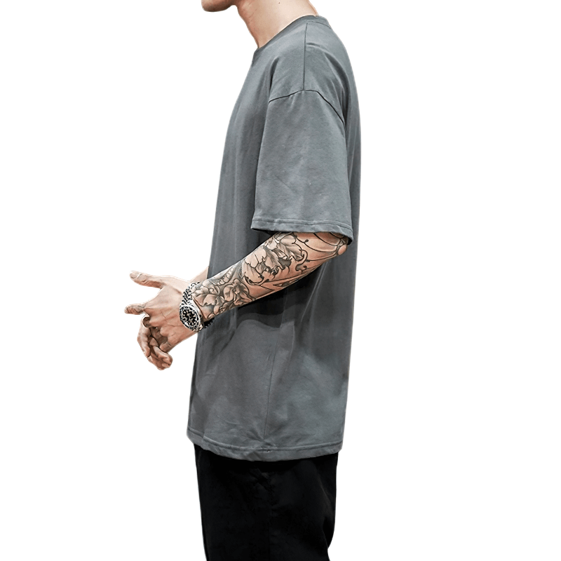 Men's oversized cotton t-shirt in gray, showcasing loose fit and alternative style, perfect for casual wear.