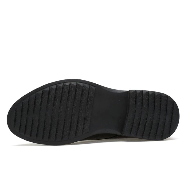 Sole of men's warm genuine leather boots showing stylish tread design for grip and comfort.