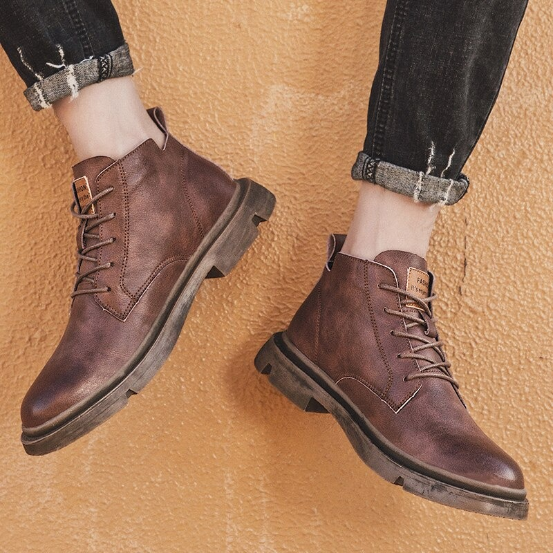 Stylish men's ankle leather boots in brown, perfect for casual wear with a non-slip rubber sole.