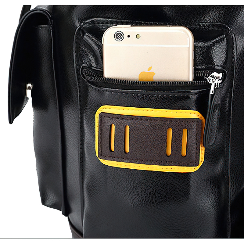 Close-up of black PU leather backpack pocket with smartphone, showcasing its practical design and multiple compartments.