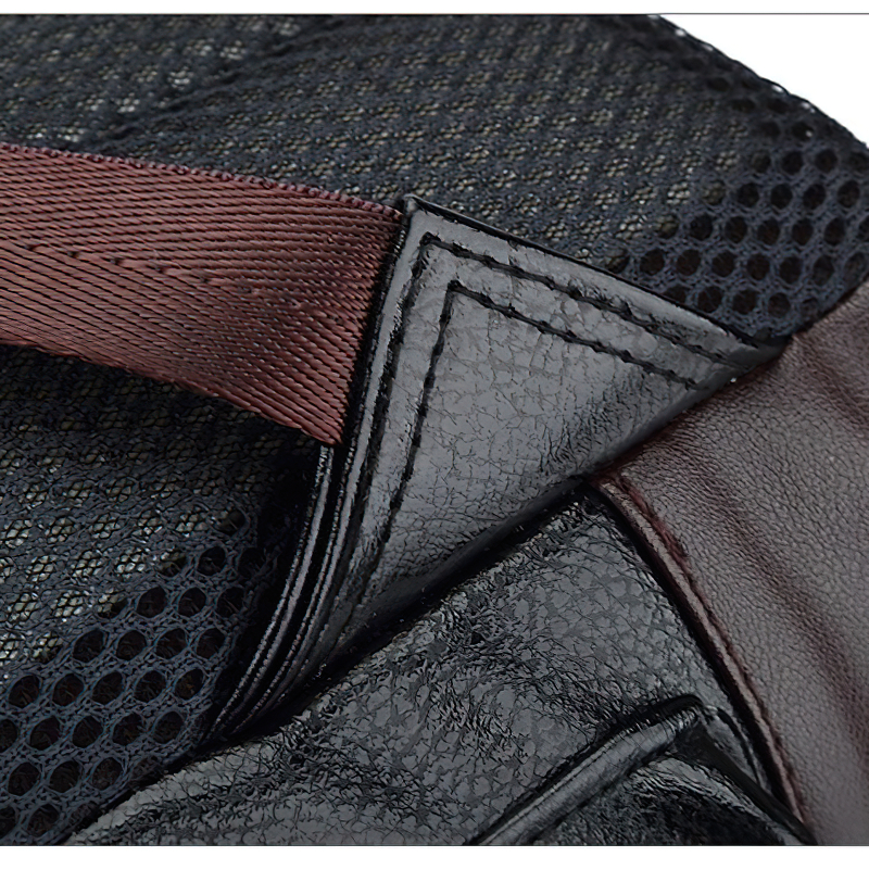 Close-up of the stylish black PU leather and mesh detail on a modern men's backpack.