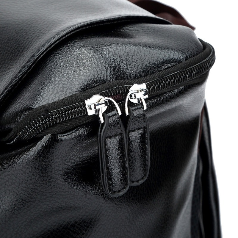 Close-up of a stylish black PU leather backpack zipper showcasing quality craftsmanship and design.