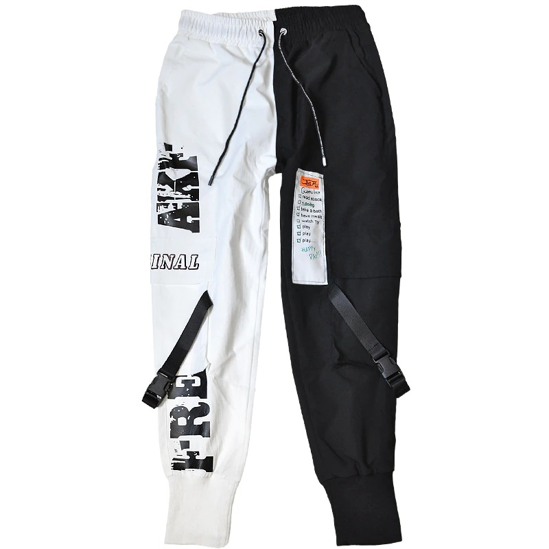Black and white patchwork men's cargo pants featuring printed inserts and pockets, ideal for casual alternative fashion.