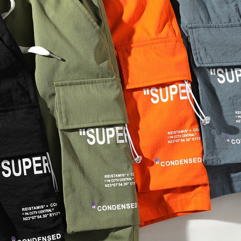 Stylish men's elastic waist shorts in black, green, orange, and gray with multi-pockets for casual wear.