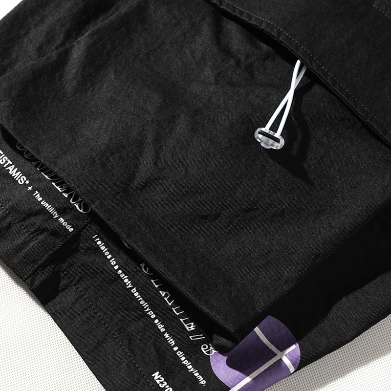 Close-up of black men's elastic waist shorts showcasing quality fabric and adjustable drawstring detail.