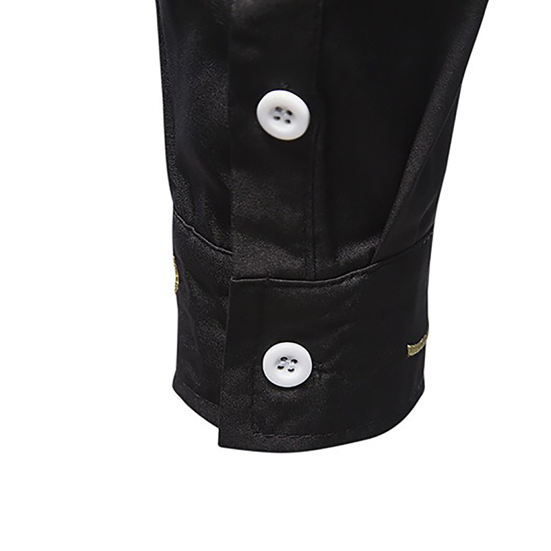 Close-up of black men's long-sleeved shirt sleeve with white buttons and elegant finish.