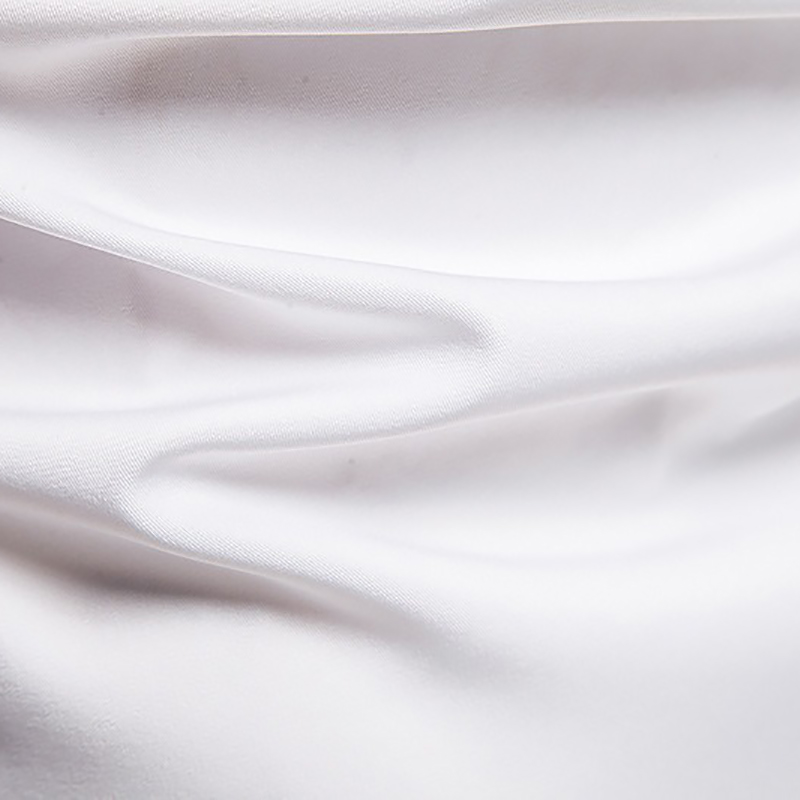 Close-up of smooth, white fabric, showcasing its silky texture perfect for stylish shirts.