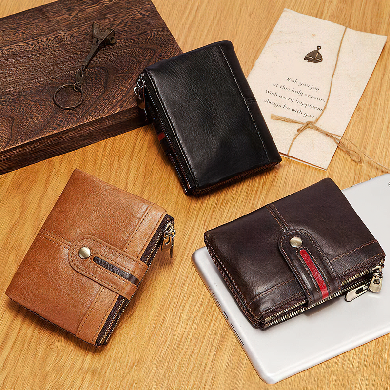 Stylish multifunction leather wallets in brown, black, and dark brown on a wooden table with a key and card.