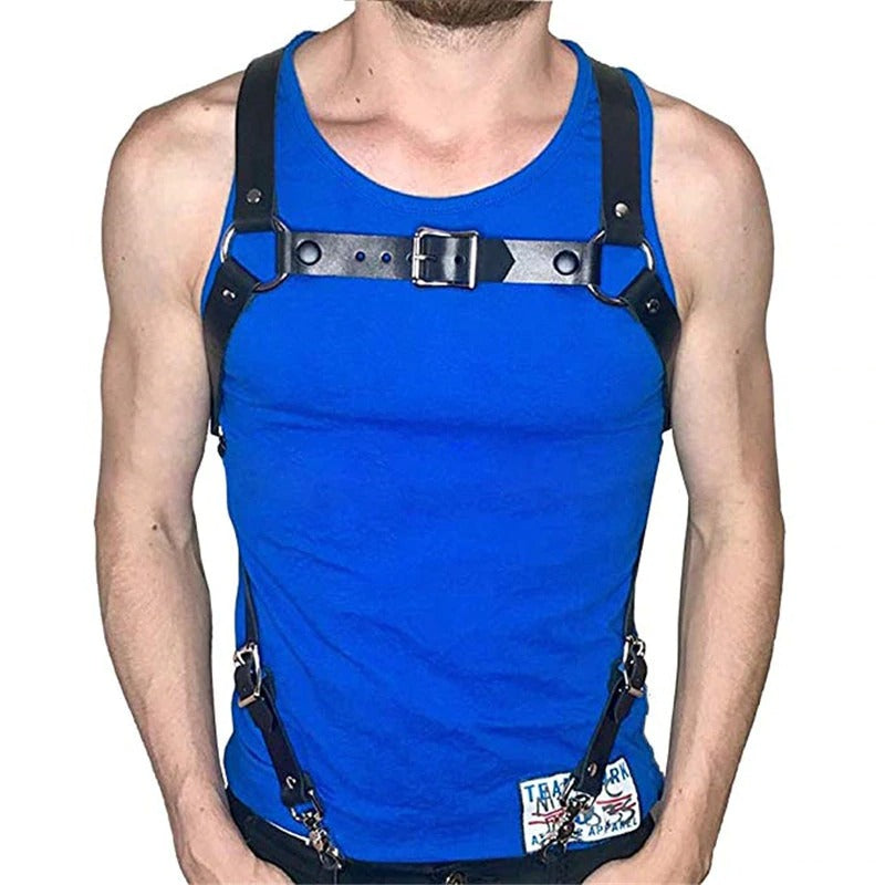 Stylish male modeling black leather body harness over a blue tank top, showcasing fashion suspenders with metal clips.