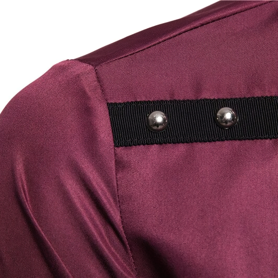 Fashion men's long sleeve shirt detail with stylish rivets in rich burgundy fabric.