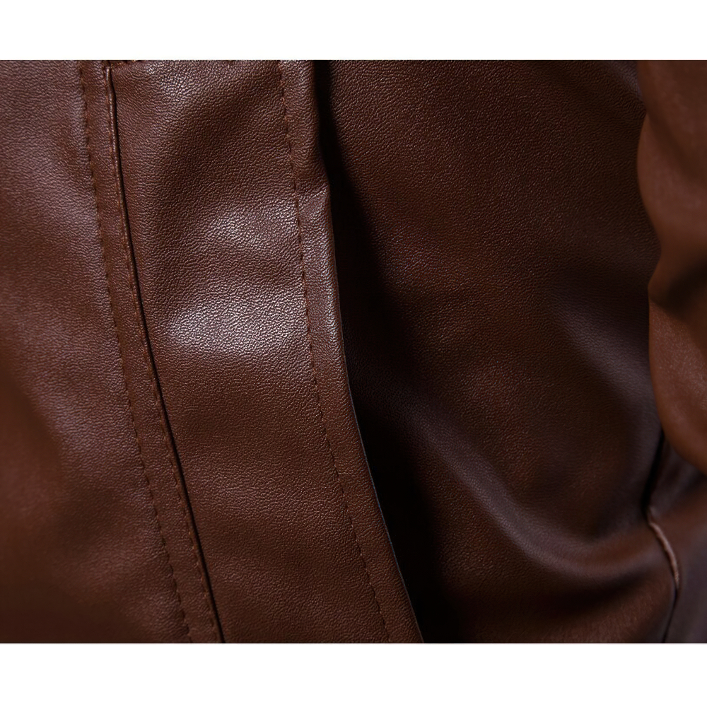 Close-up of premium brown PU leather showcasing texture and stitching of a stylish biker jacket.