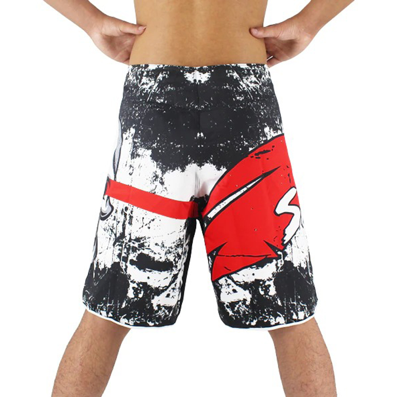 Men's loose training shorts showcasing a striking skull print in black and red, perfect for activewear or casual outings.