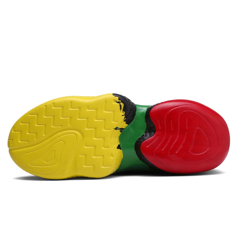 Colorful sole of men's lace-up sneakers featuring yellow, green, black, and red designs for casual walking comfort.