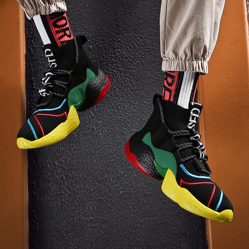 Men's lace-up sneakers in vibrant black, yellow, red, and green colors, perfect for casual walking and breathability.