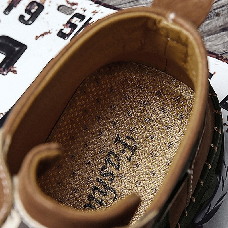 Interior view of men's genuine leather boots showing cushioned insole for comfort and style.