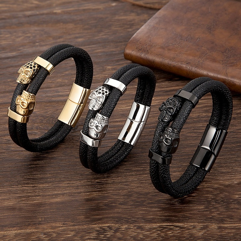 Stylish men's punk leather bracelet with skull magnetic clasps in gold, silver, and black options.