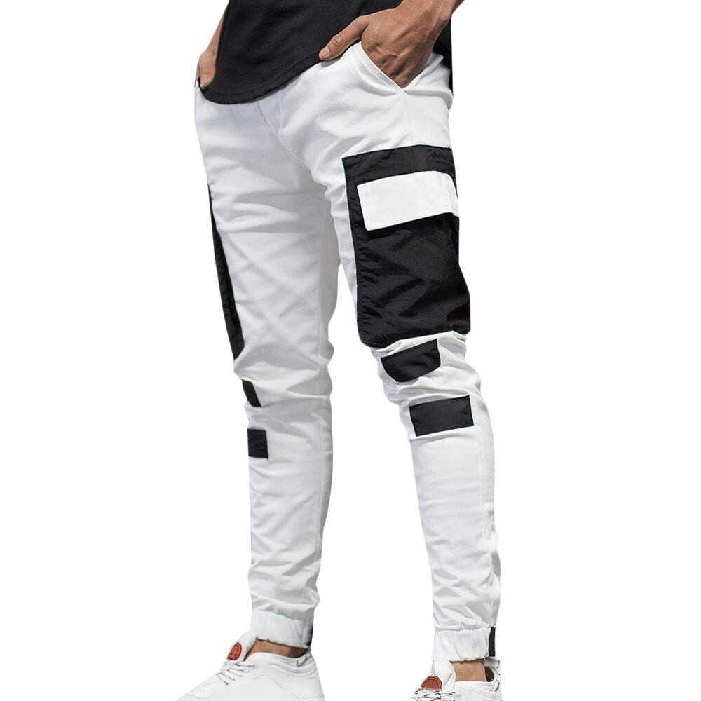 Men's streetwear joggers pants in white with black patch pockets, perfect for sporty casual outfits.