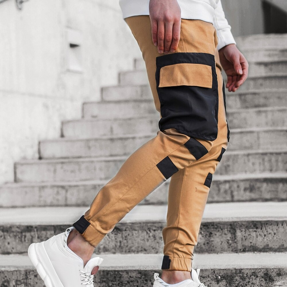 Men's streetwear joggers pants with patch pockets in beige and black, perfect for casual style and comfort.