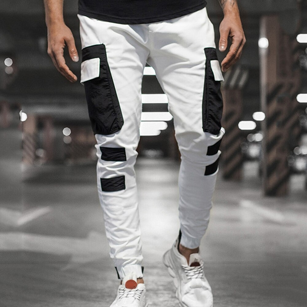 Men's streetwear joggers pants in white with black patch pockets, perfect for casual sporty looks.