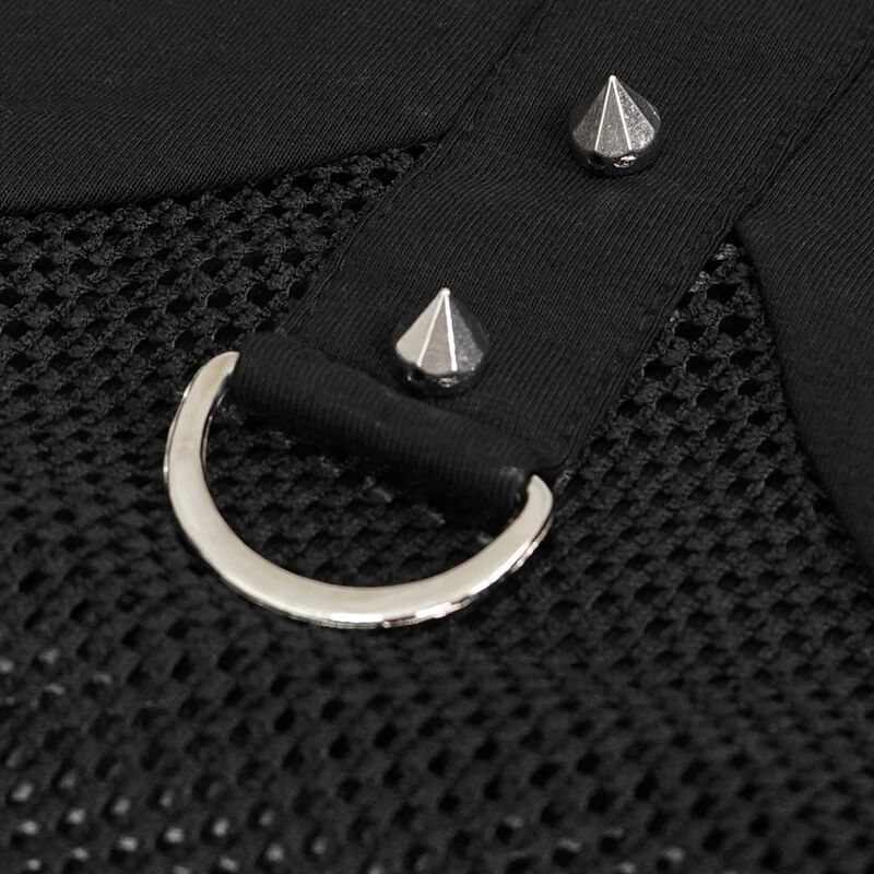 Close-up of black mesh fabric with silver spikes and circular ring detail, perfect for a gothic fashion top.