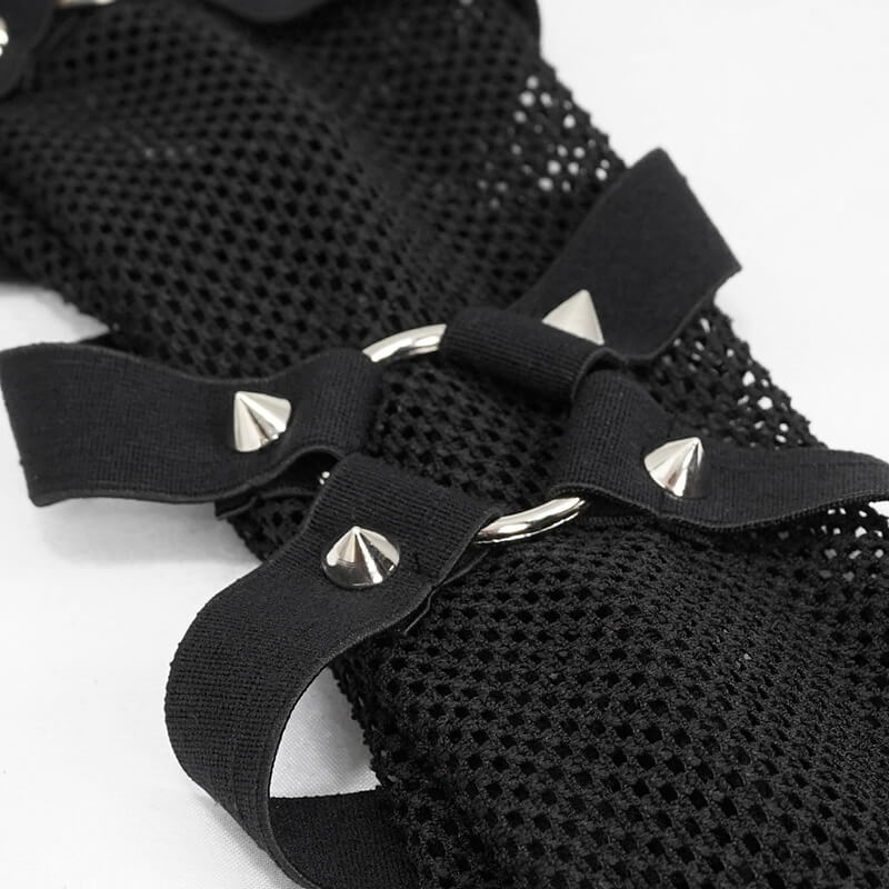 Close-up of black mesh fabric with stylish spikes and straps, perfect for gothic fashion enthusiasts.