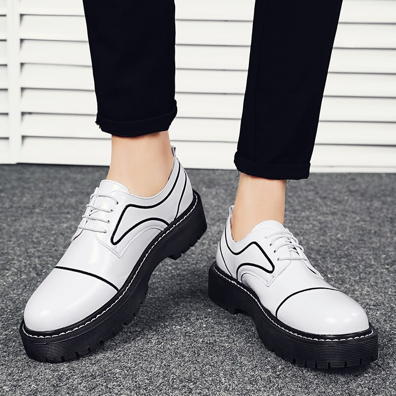 Stylish men's casual Oxfords in white PU leather with laces and thick black sole, perfect for formal meetings.