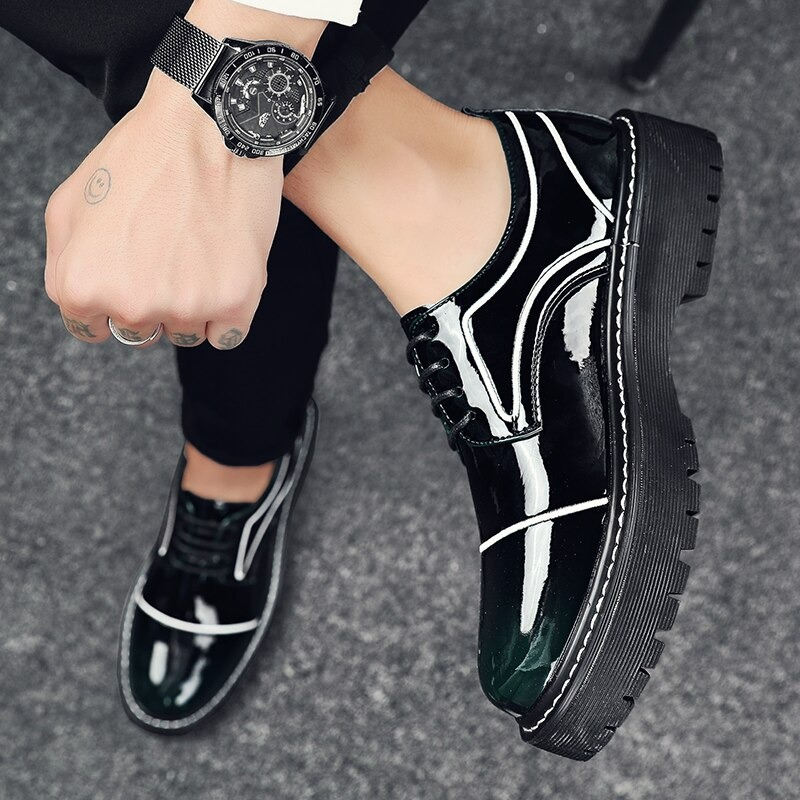 Stylish men's oxfords in glossy patent leather with thick soles, perfect for casual and formal occasions.