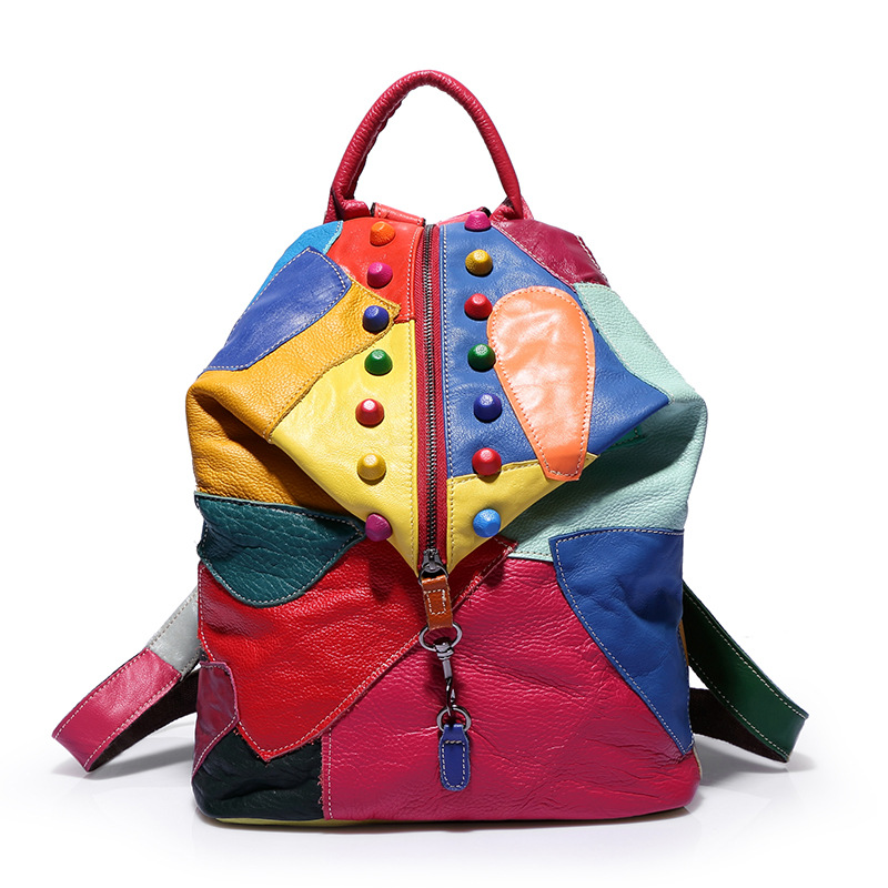 Vibrant women’s panelled designer leather backpack with colorful patterns and decorative buttons.