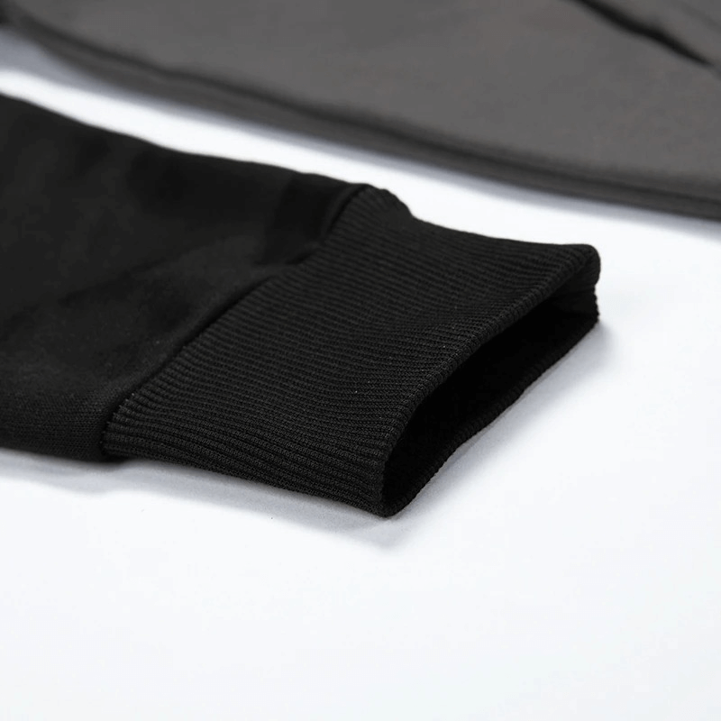 Close-up of a black fleece hoodie cuff, showcasing ribbed detail and premium fabric for stylish comfort.