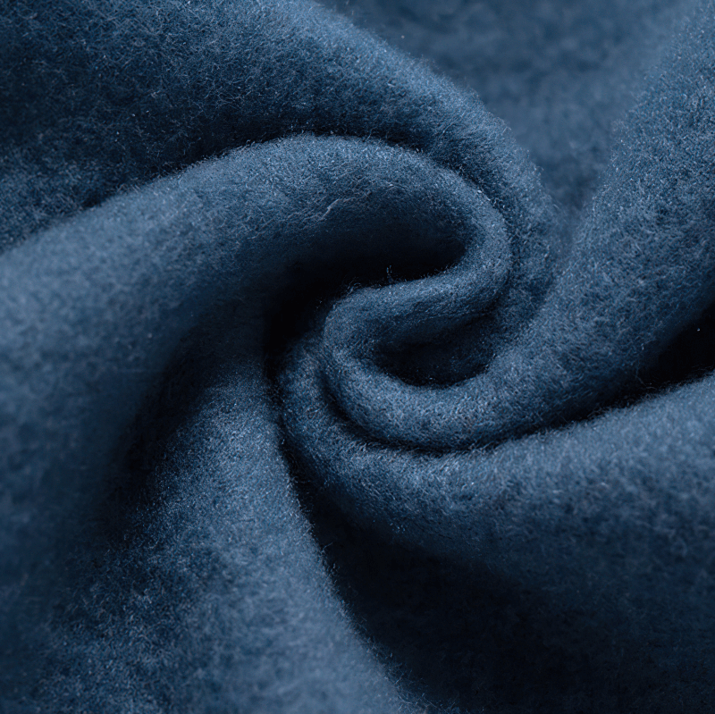 Close-up of soft blue fleece fabric showcasing its cozy texture and quality for trendy hoodies.