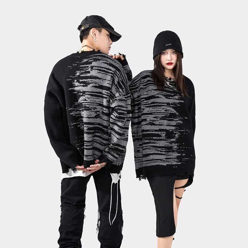 Stylish oversized knitted sweater for men and women in black with trendy print, perfect for streetwear fashion.