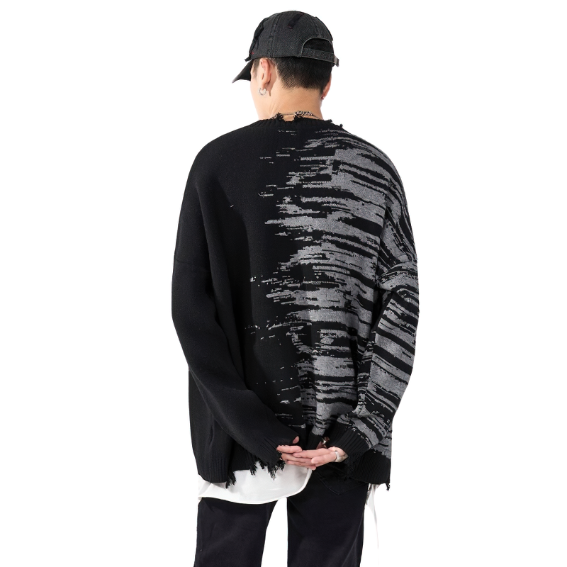 Men's oversized patchwork knitted sweater in black with trendy print, perfect for streetwear styling.