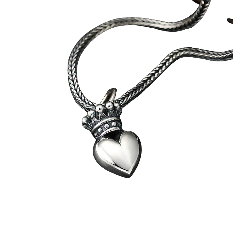 Stylish women's sterling silver pendant with crowned heart design on a braided chain.