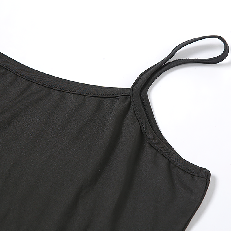 Close-up of a black dress strap showcasing the fabric detailing of a casual, gothic-style mini dress.