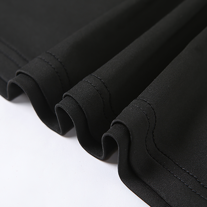 Close-up of the smooth black fabric showcasing neat stitching details on a Gothic style dress.