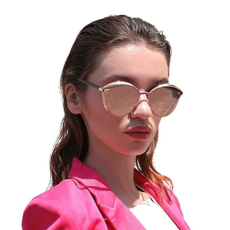 Stylish woman wearing polarized pink cat-eye sunglasses, exuding casual fashion confidence in a bright pink blazer.