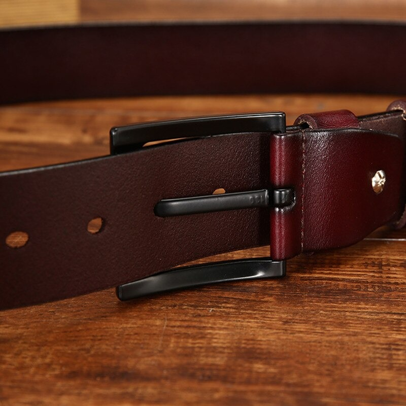 Close-up of a trendy men's PU leather belt with a black buckle, perfect for casual outfits.